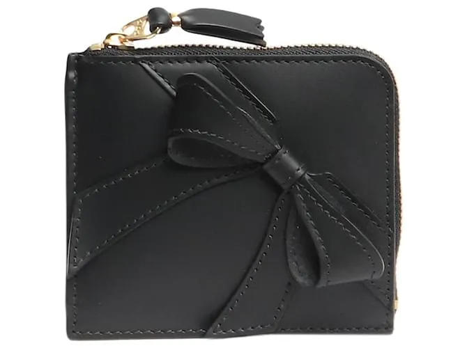 Comme Des Garcons Portafoglio con zip grande fiocco nero