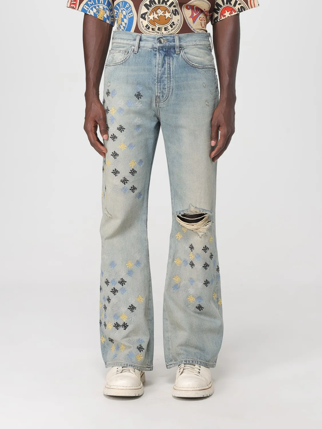 Jeans con logo all-over Amiri