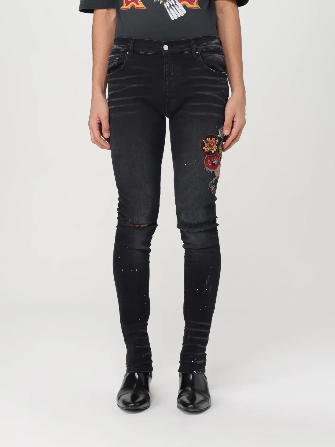 Jeans Amiri in denim con patch logo